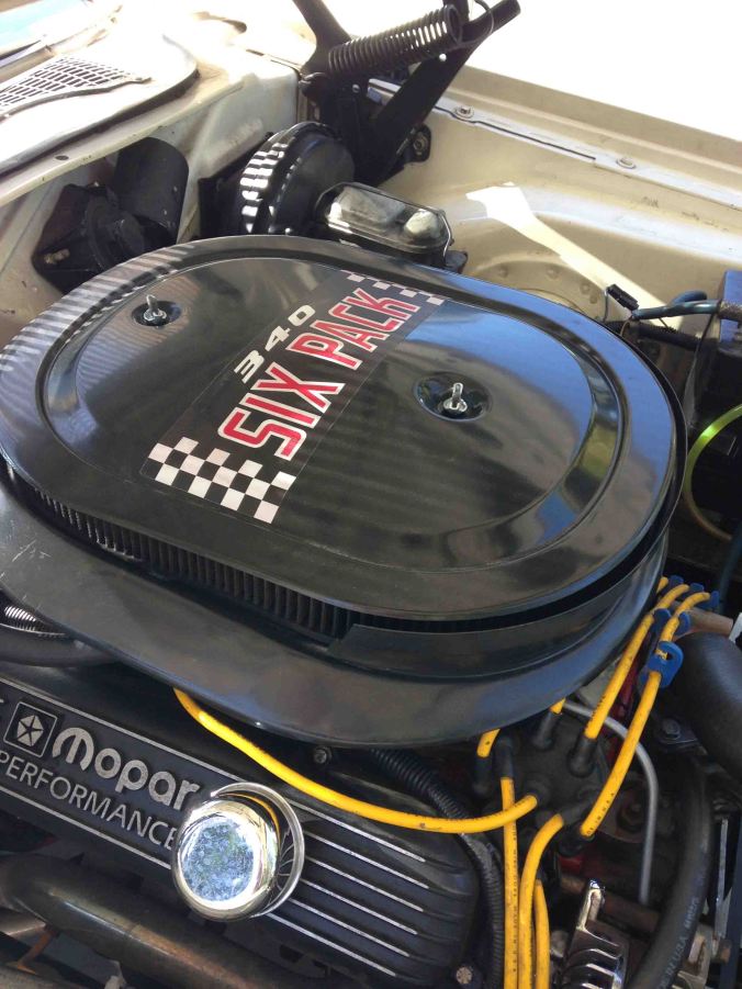 Done. The test drive that day revealed NO popping out the carb. I thought I had fixed the problem. But as I push the engine harder, like I did the following weekend. It still backfires through the carb under harder acceleration. When this thing stops popping, it is going to accelerate like mad money. Notice the 340 decal - this air cleaner assembly was from my Challenger T/A when I first bought it. It was the wrong assembly for a small block, but correct for a big block. I sold the T/A a few years ago, it was completely restored with the correct small block T/A air cleaner. I may keep this decal on just as a remembrance of the old car and to mess with people's minds.