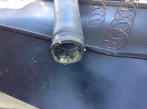 The corrosion residue on the water pump end of the lower hose. The growth is matched on the water pump side. The coils are from the hose, in three pieces.