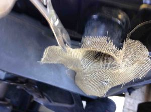 Here's how I roughly fit some copper screen into and around the lip of the upper rad inflow pipe. Then trim to size with a scissors.