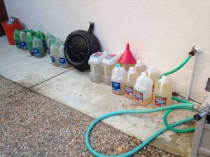 Here is my collection of drained coolant from my 440. Notice the progression from left to right. I empty about 2.5 gallons per draining. I'm almost at a pure enough state I'm willing to add the Water Wetter. I have some observations about before and after installing the thermostat which I will share in a later article.